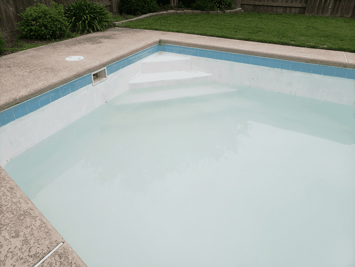 Cloudy milky white pool water hiding the pool steps